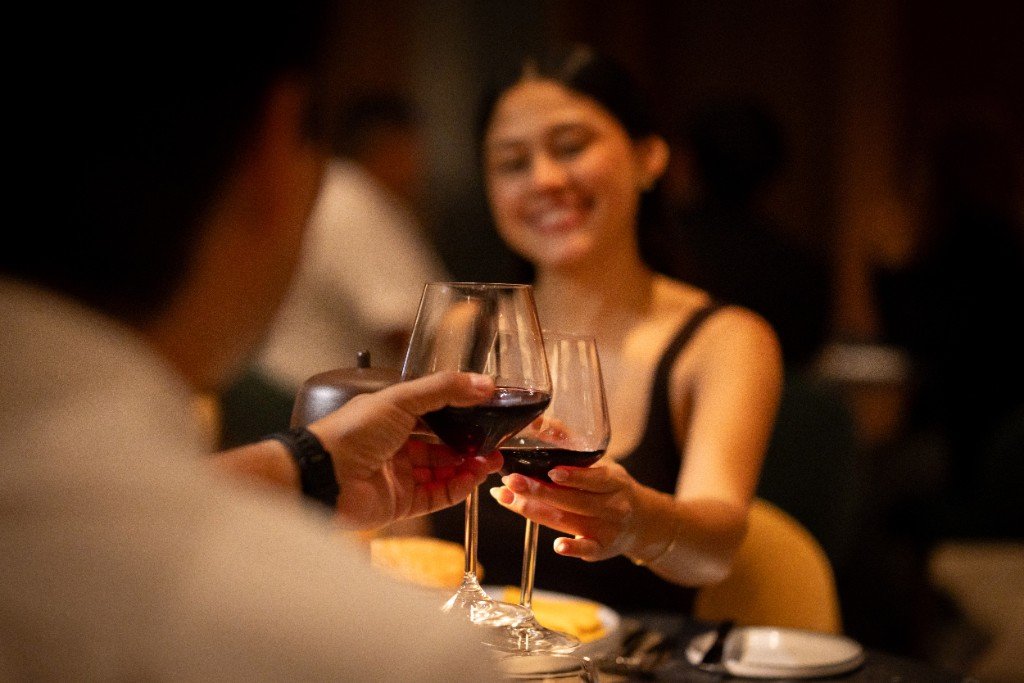 Couple enjoying wine at a Moon Palace The Grand restaurant